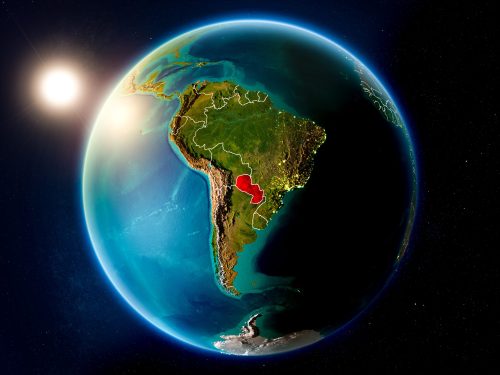 Sunset above Paraguay highlighted in red on planet Earth with visible country borders. 3D illustration. Elements of this image furnished by NASA.